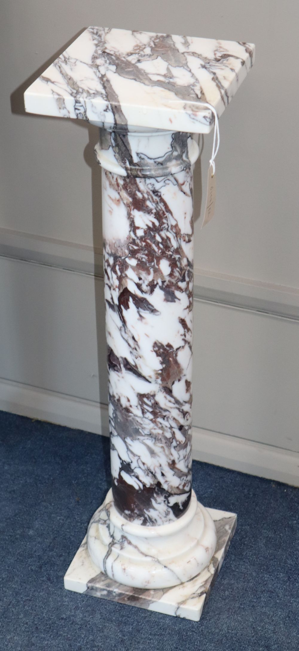 A reconstituted marble pedestal, H.74cm